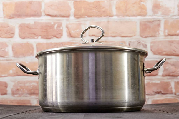 A studio photo of pots and pans - Foto, imagen