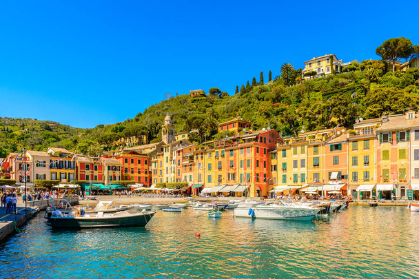 PORTOFINO, ITALY - MAY 4, 2016: Beautiful harbour of Portofino, an Italian fishing village, Genoa province, Italy. A vacation resort with celebrity and artistic visitors. - Valokuva, kuva