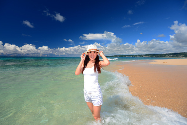 Young woman on the beach enjoy sunlight - Photo, image