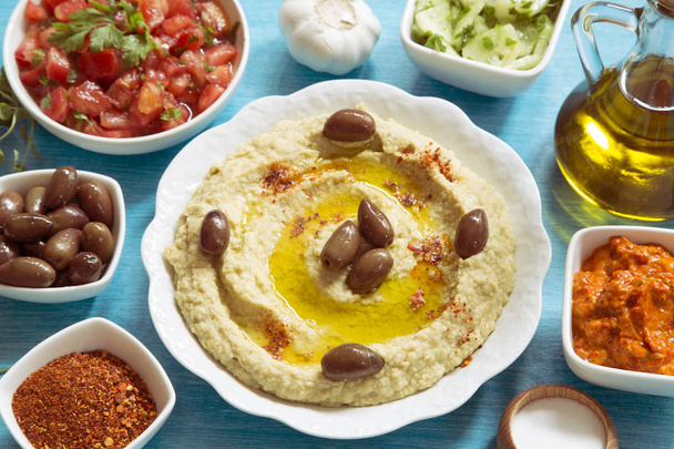 Traditional hummus with spices and vegetables - Photo, image