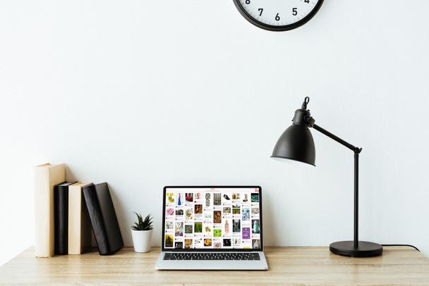 laptop with pinterest website on screen on work desk at office - 写真・画像