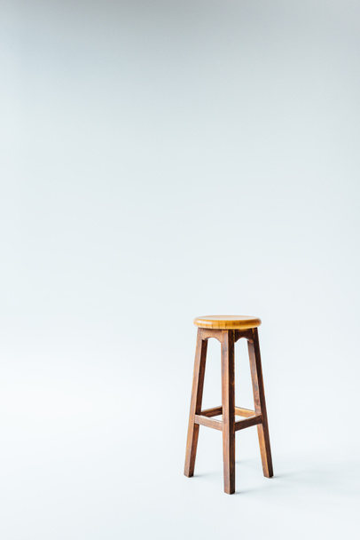 single vintage wooden stool on white - Photo, Image