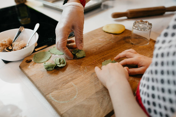 Master class on cooking, pasta, dumplings in a beautiful kitchen for children - Foto, Imagen