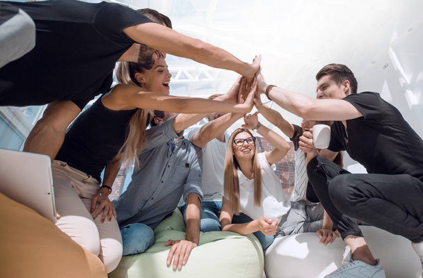 team of young people giving a high five - Fotoğraf, Görsel