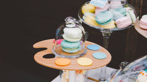 colorful French macaroons at a buffet table. Traditional macaroons close-up. - Photo, Image