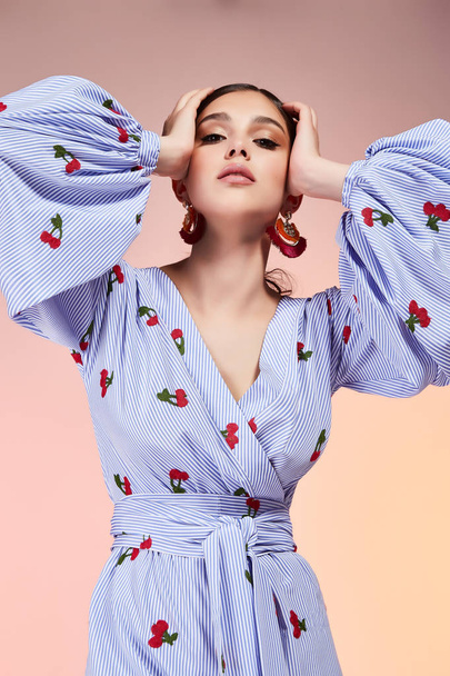 Portrait of beautiful sexy woman perfect face cosmetic skin care beauty salon hairdo hair style model blush mascara lipstick glamor collection accessory jewelry earrings cream young pure blouse blue. - 写真・画像