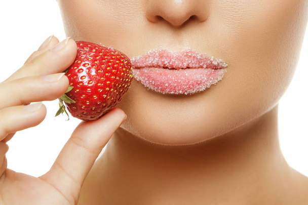 Close up view of female lips in sugar and strawberry - Zdjęcie, obraz