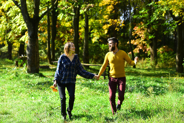 Autumn time and dating concept. Girl and bearded guy - Фото, изображение
