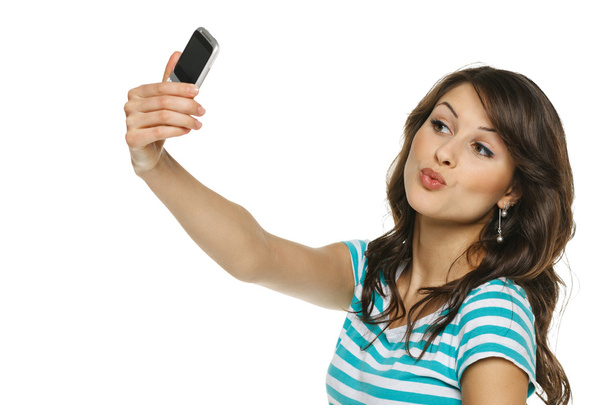 girl giving kiss to cellphone - Photo, Image