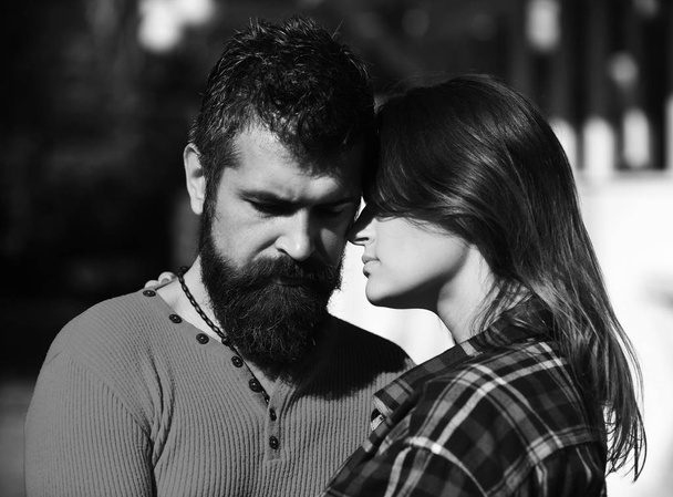 Couple in love cuddling, close up. Girl and bearded guy or happy lovers on date hug - Foto, Bild