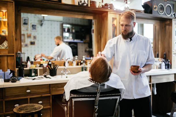 Hair beard and mustache treatment in barber shop - 写真・画像