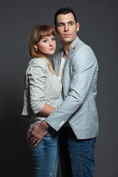 Young couple man and woman in love. Studio shot. - Fotó, kép