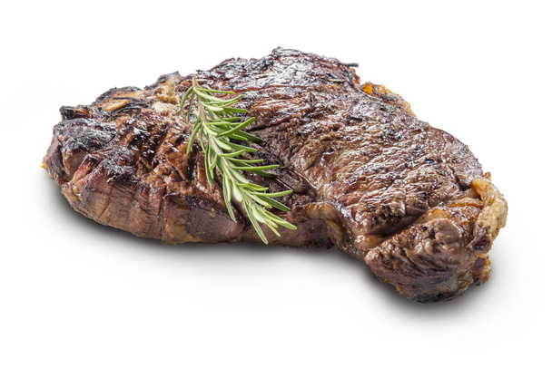 Ganzes gegrilltes T-Bone Steak mit Rosmarin isoliert auf weißem Hintergrund - Foto, Bild