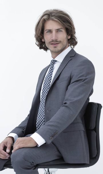 Inviting business man sitting on chair with relaxed attitude - Foto, Imagen