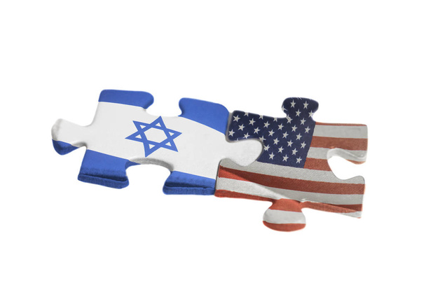 USA and Israel flags on puzzle pieces. Political relationship between governments concept. isolated on a white background - Valokuva, kuva