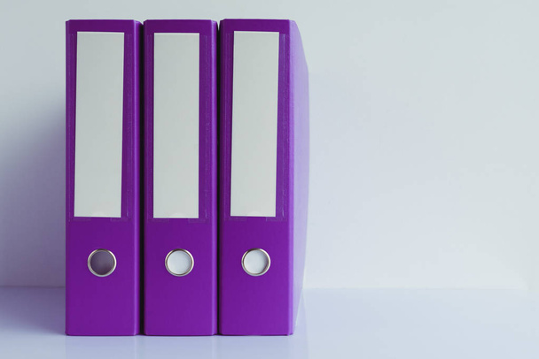 Purple file document ring binders in accountant and bookkeeping business office - Foto, afbeelding