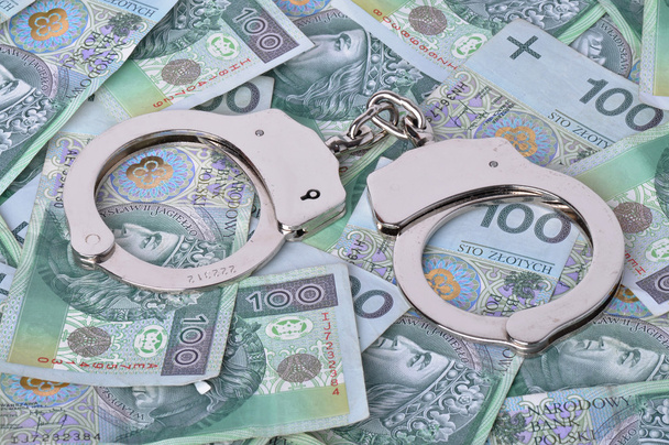 hancuffs and banknotes in background - Foto, Imagem