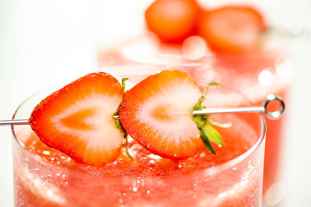 Kentucky kiss burbon cocktail garnished with fresh strawberries. - Photo, Image