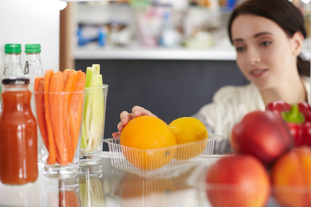 Open refrigerator with fresh fruits and vegetable. Open refrigerator - Fotografie, Obrázek