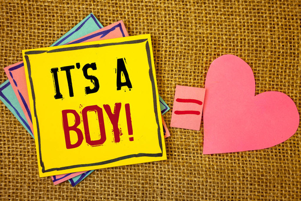 Conceptual hand writing showing It S A Boy Motivational Call. Business photo texts Male baby is coming Gender reveal CelebrationIdeas created on note papers equal sign heart wicker background - Photo, Image