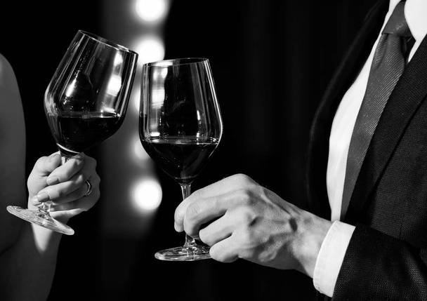 celebrating success. cheers, couple clink glasses with red wine - Fotografie, Obrázek