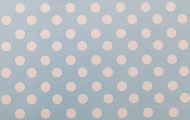 Abstract image of a pale blue paper pattern with white circles. - Foto, Imagem