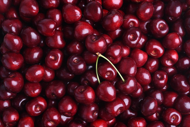 Fresh sweet cherry fruit on the market as background - Photo, Image