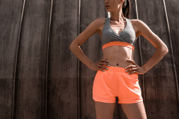 cropped view of athletic woman posing in sportswear - Foto, immagini