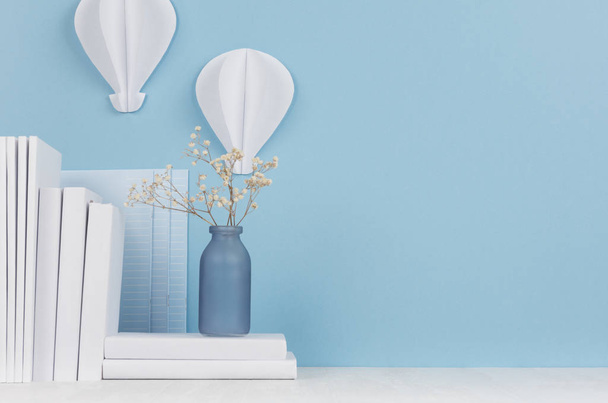 Creative workplace for designers and students - white office stationery and paper hot air ballons origami on table and blue background. Back to school background with copy space. - Фото, изображение