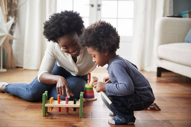 Mother And Young Son Playing With Wooden Toy At Home - Fotoğraf, Görsel