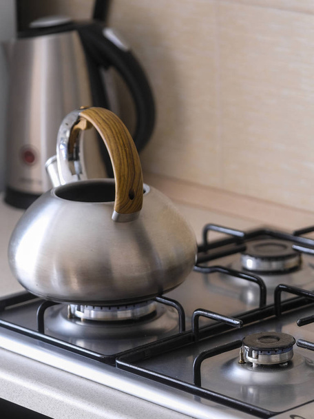 The image of a gas stove close up with kettle and pan - Valokuva, kuva