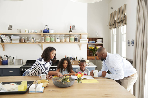 Young black family together at kitchen - Фото, изображение