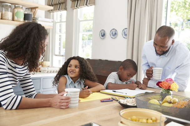 Young black family together at kitchen - Photo, image