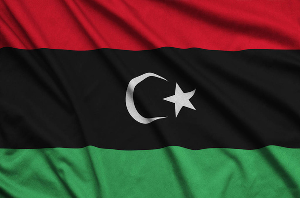 Σημαία της Λιβύης απεικονίζεται ένα σπορ ύφασμα με πολλές πτυχώσεις. Ομάδα Αθλητισμός κυματίζει banner - Φωτογραφία, εικόνα