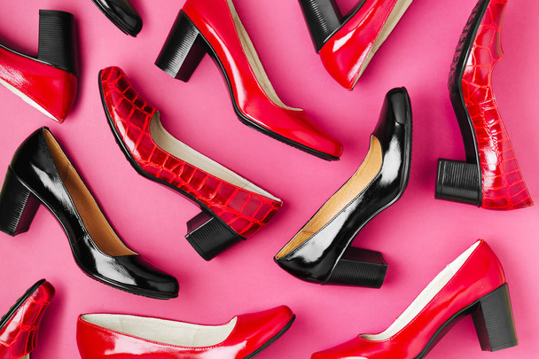 Stylish female spring or autumn shoes in red colors. Beauty and fashion concept. Flat lay, top view - 写真・画像