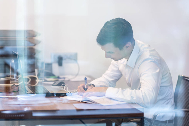 Businessman working with documents in the office - Photo, image