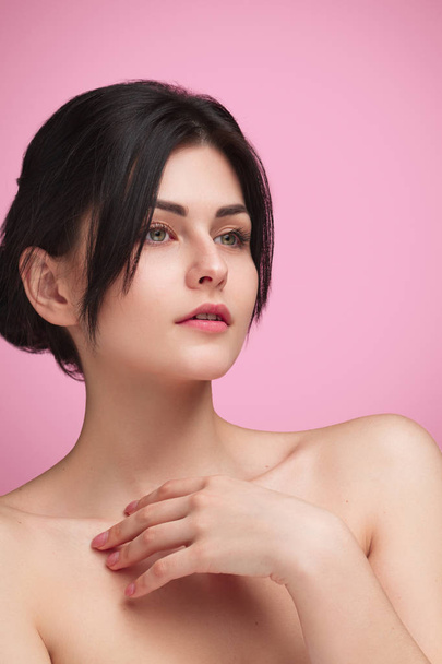 Tender model with soft skin on pink - Фото, изображение
