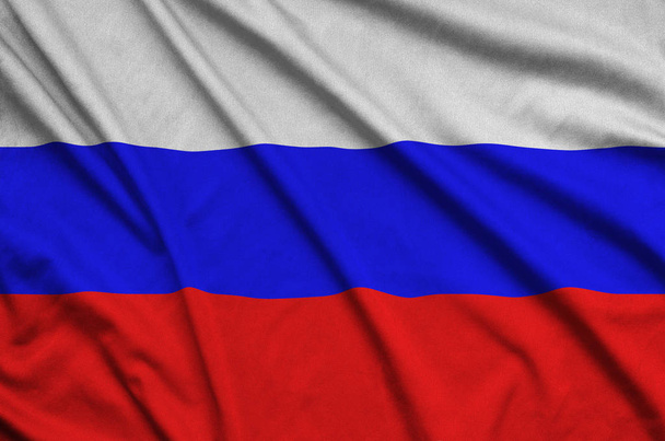 Drapeau de la Russie est représenté sur un tissu de tissu de sport avec de nombreux plis. Bannière d'agitation d'équipe sportive
 - Photo, image