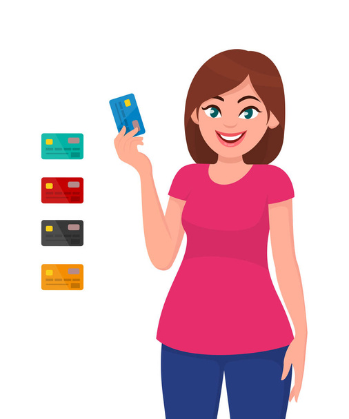 Νεαρή γυναίκα κρατώντας και δείχνοντας πιστωτική κάρτα ή χρεωστική καλάθι. Τραπεζική και πληρωμή έννοια. - Διάνυσμα, εικόνα