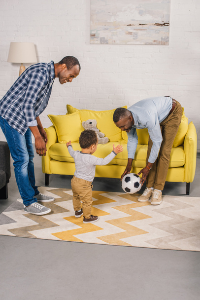 happy african american family playing with soccer ball at home  - Foto, immagini