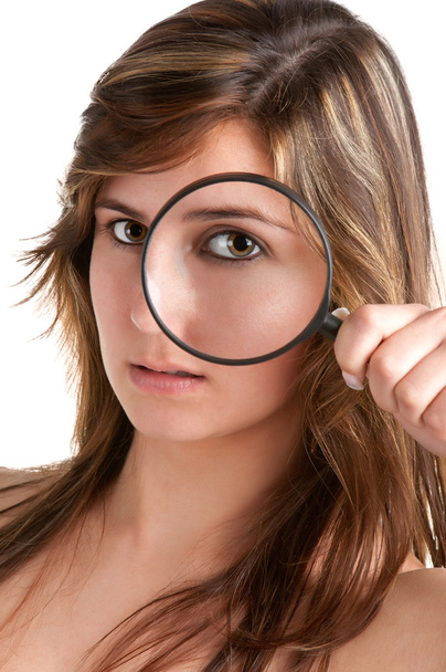 Woman looking trough a loupe - Foto, immagini
