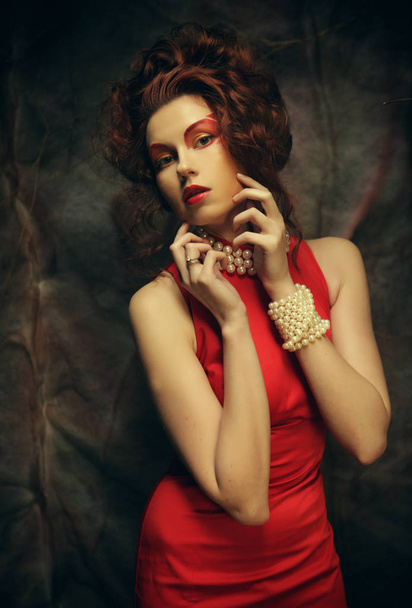 Sexy young beauty brunette woman in red dress - Fotó, kép