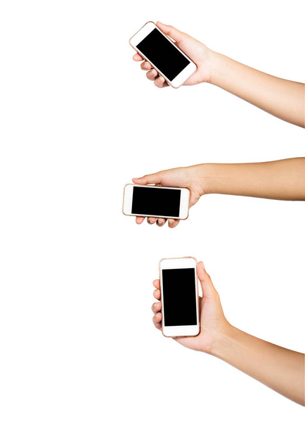 Ręka trzyma wielu ekranu tabletu lub smartfonu czarny ekran na białym tle. Ścieżki przycinające. - Zdjęcie, obraz