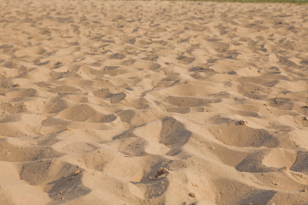 Closeup of sand pattern of a beach in the summer. Background.concept for summer season. - Fotografie, Obrázek