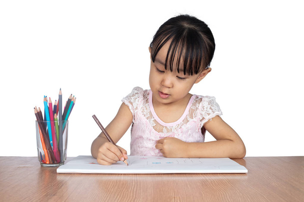 Asian Little Chinese girl painting on paper in isolated white background - Φωτογραφία, εικόνα