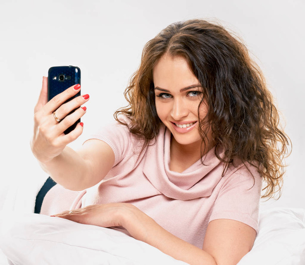 Making selfie in bed - Photo, Image