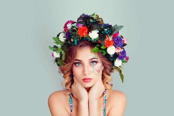 Beautiful young woman smiling model with white red magenta dianthus flowers head floral headband hands on neck posing looking at you camera isolated on light green gray background Spring style concept - Photo, image
