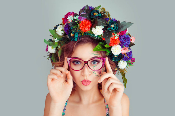 Beautiful young woman model, white red magenta dianthus flowers head floral headband puckered lips blowing air kiss looking at you camera isolated on light green gray background. Spring summer style - Valokuva, kuva