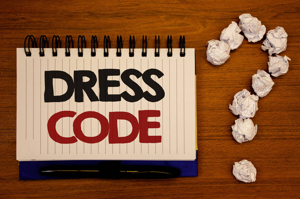 Text sign showing Dress Code. Conceptual photo Rules of what you can wear and not to school or an eventIdeas on notebook wooden background quotation mark made of crumpled papers - Foto, afbeelding