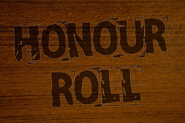 Conceptual hand writing showing Honour Roll. Business photo showcasing List of students who have earned grades above a specific averageBold brown letters words ideas on wooden background - Photo, Image